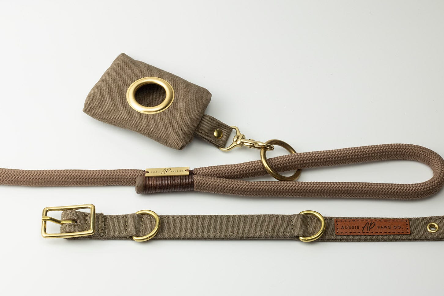 brown canvas dog poo bag holder and brown dog collar and brown rope dog lead